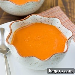 A creamy, rich bowl of dairy-free tomato soup, perfect for a cozy meal.