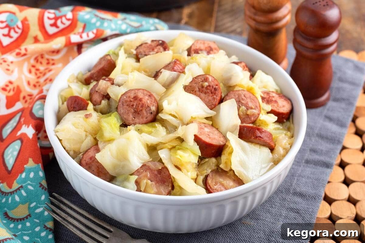 A warm, comforting serving of Instant Pot Cabbage and Kielbasa in a white bowl, ready to be enjoyed.