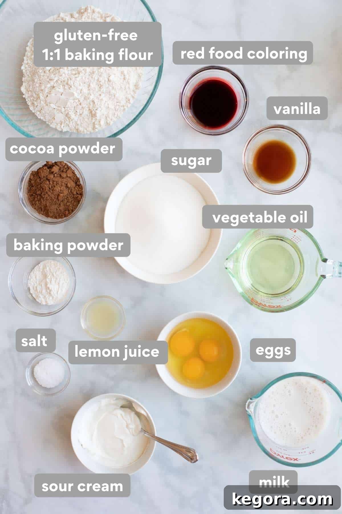 An overhead shot showcasing all the fresh, high-quality ingredients laid out for making a delicious gluten-free red velvet cake.