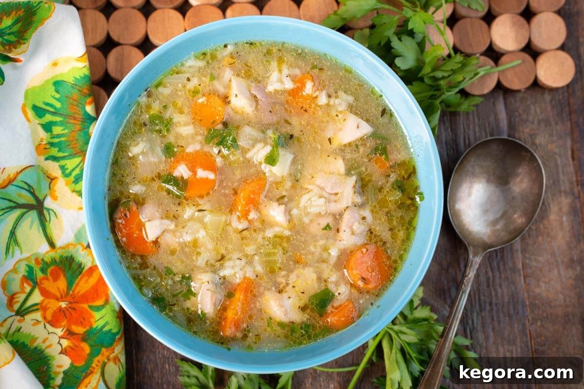 Chicken Rice Soup in a blue bowl.