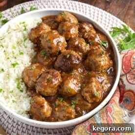 Instant Pot Turkey Meatballs and Gravy on a grey bowl.