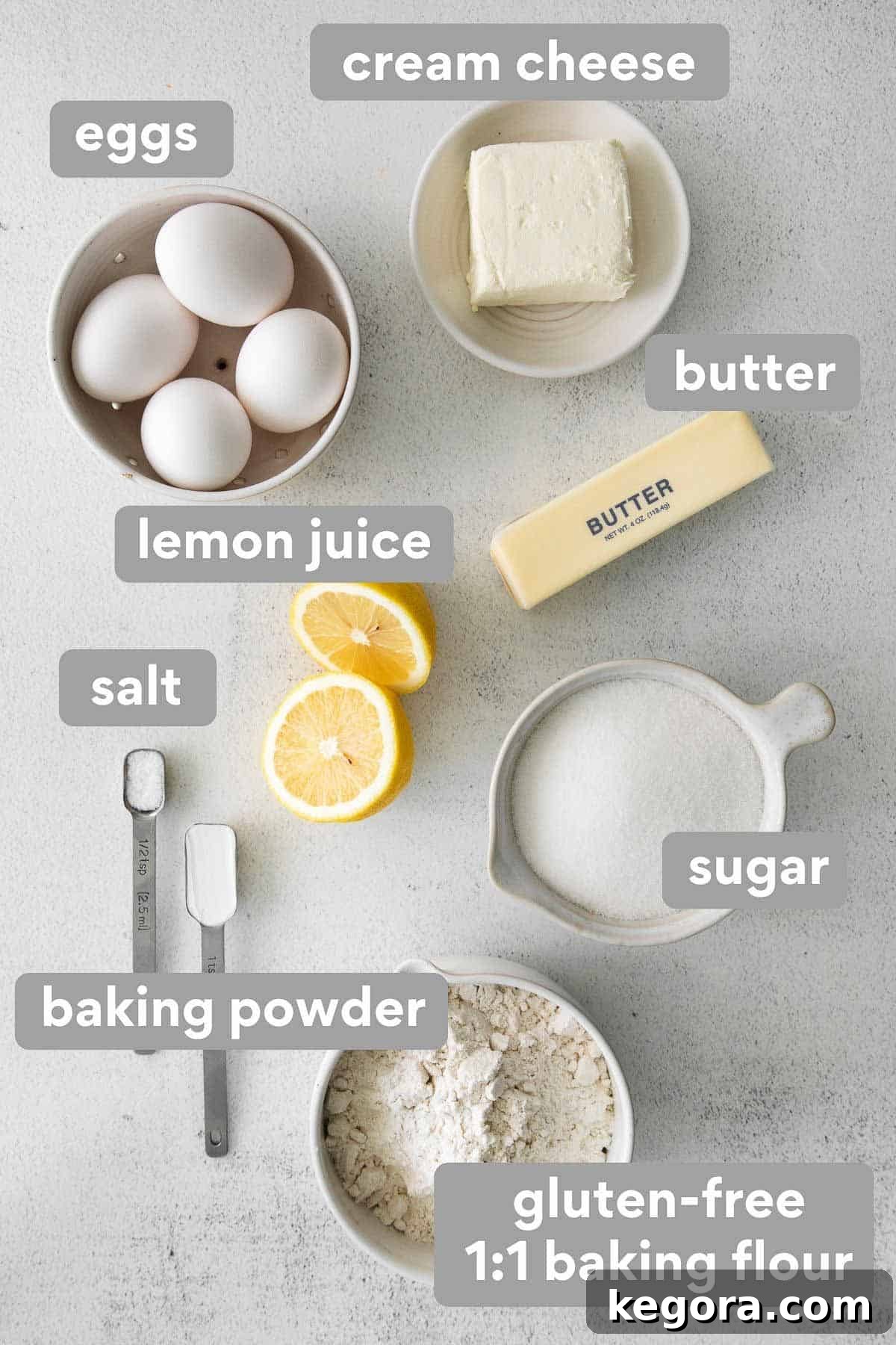 Seriously Delicious Gluten-Free Pound Cake 3 Key ingredients for gluten-free pound cake laid out on a kitchen counter: flour, sugar, butter, eggs, cream cheese, and lemon.