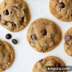 Aerial view of peanut butter cookies with flakes of salt, indicating a perfect balance of sweet and savory in these gluten-free flourless treats.
