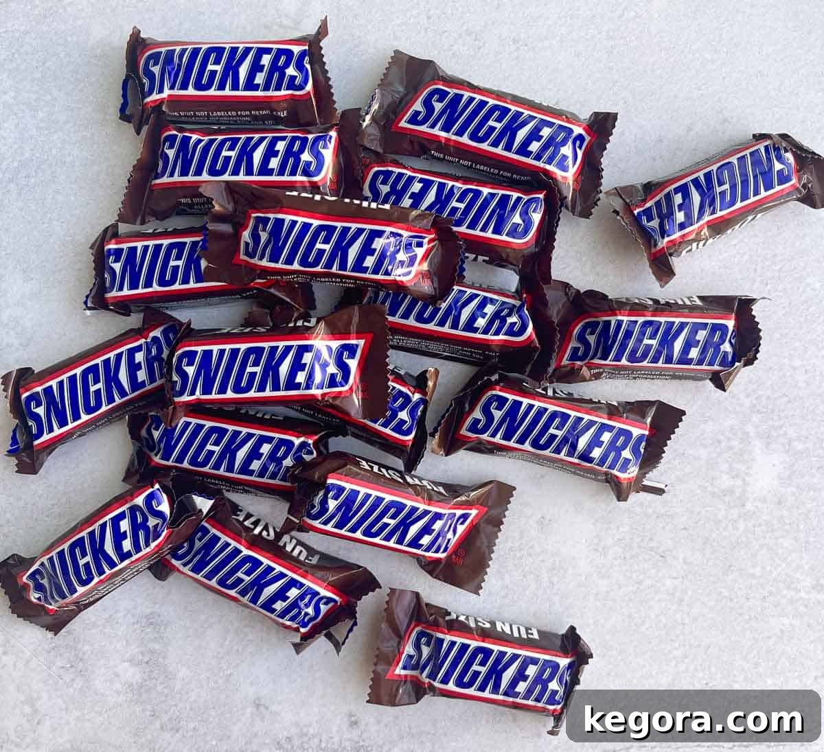 overhead shot of mini snickers bars on counter