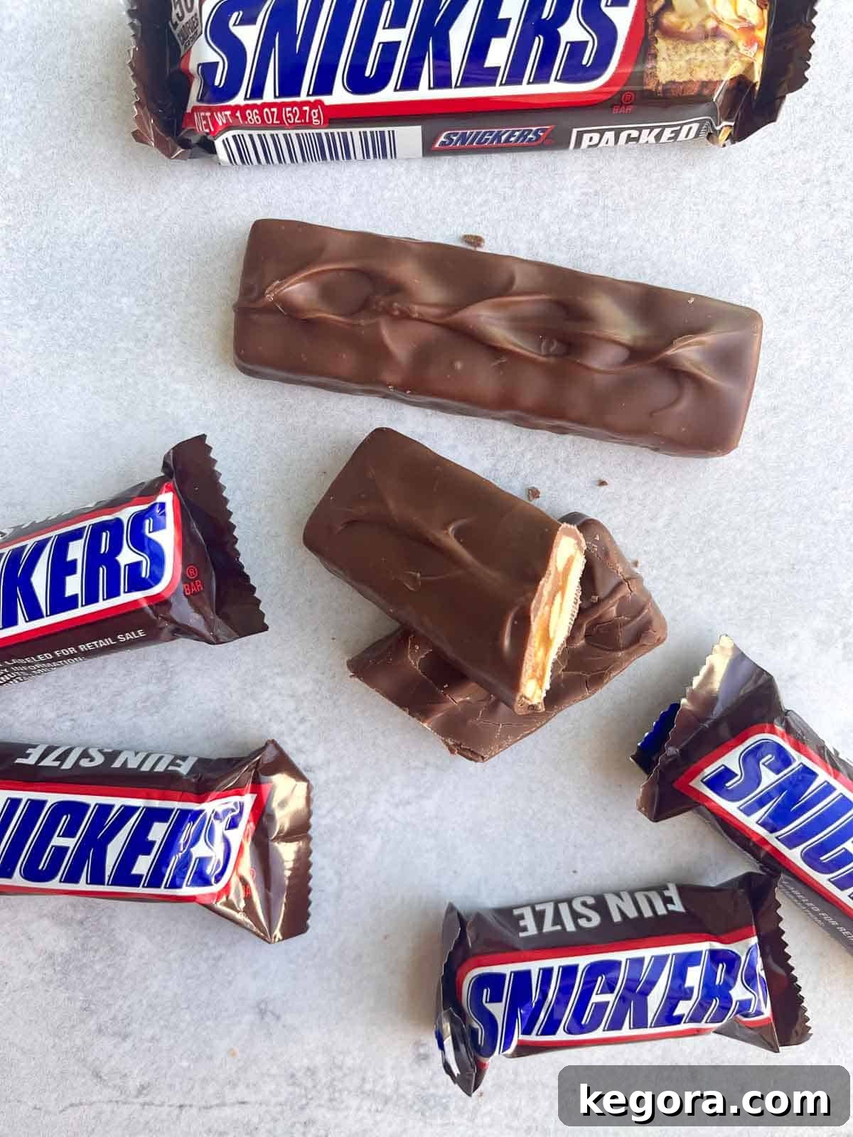 mini snickers on counter with snickers bar cut in half