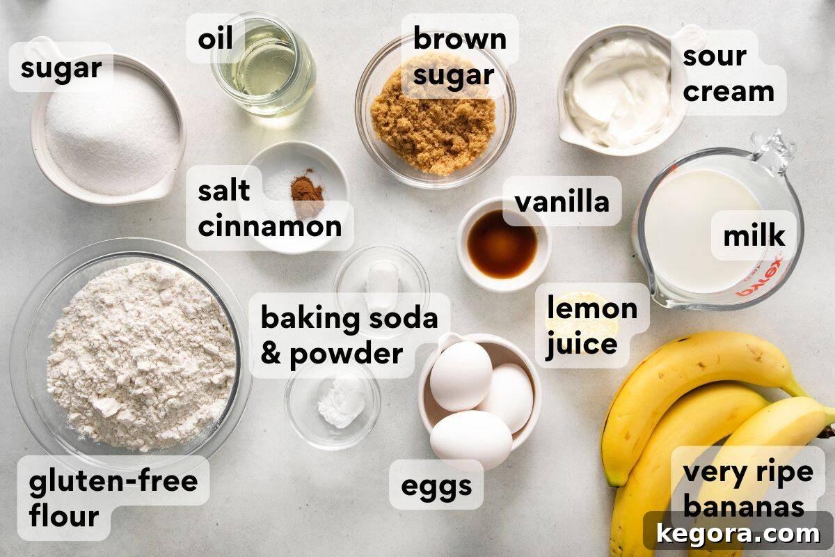 Golden Gluten-Free Banana Treat 4 All ingredients for a gluten-free banana cake measured and labeled, including flour, sugars, eggs, bananas, and dairy products.
