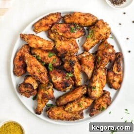 Air Fryer Lemon Pepper Chicken Wings on a plate.