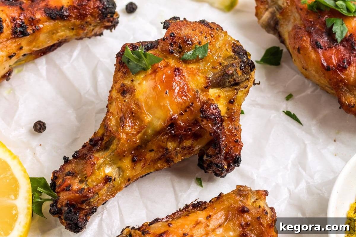 A close-up shot of an Air Fryer Chicken Wing, showing its crispy skin and golden-brown color.