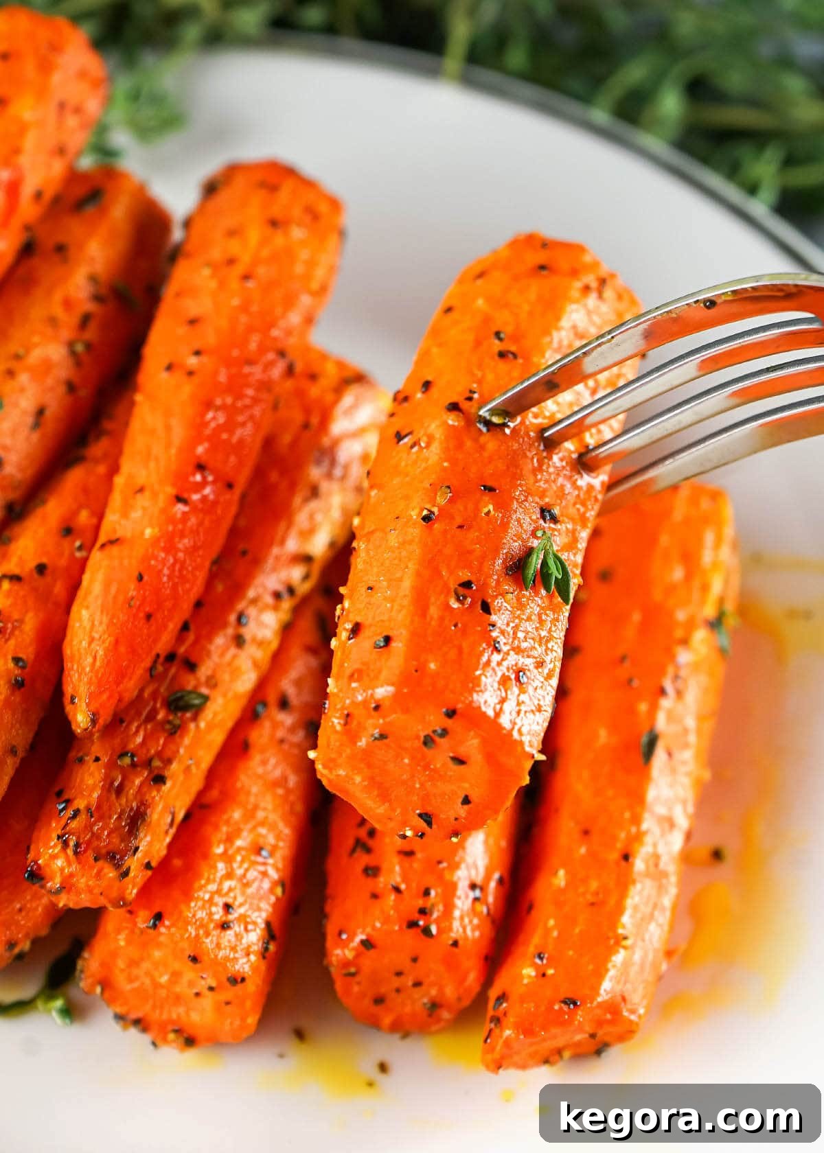 Crispy Air Fryer Carrots 8 Carrots on fork.