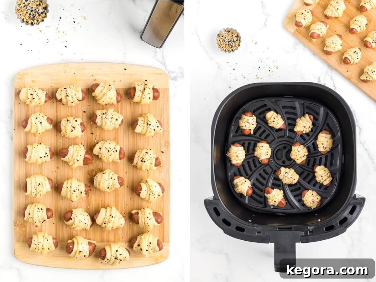 Image showing wrapped hot dogs being brushed with egg wash and sprinkled with seasoning, then placed in an air fryer basket.