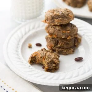 Close-up of a stack of healthy carrot cake power cookies, showing their texture and inviting nature, perfect for a guilt-free treat.
