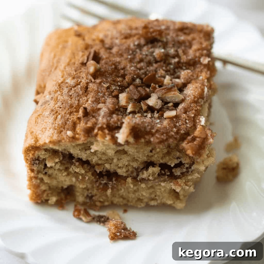 A comforting slice of gluten-free coffee cake with a generous crumb topping.