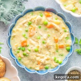 Instant Pot Chicken Pot Pie Soup in a blue bowl.