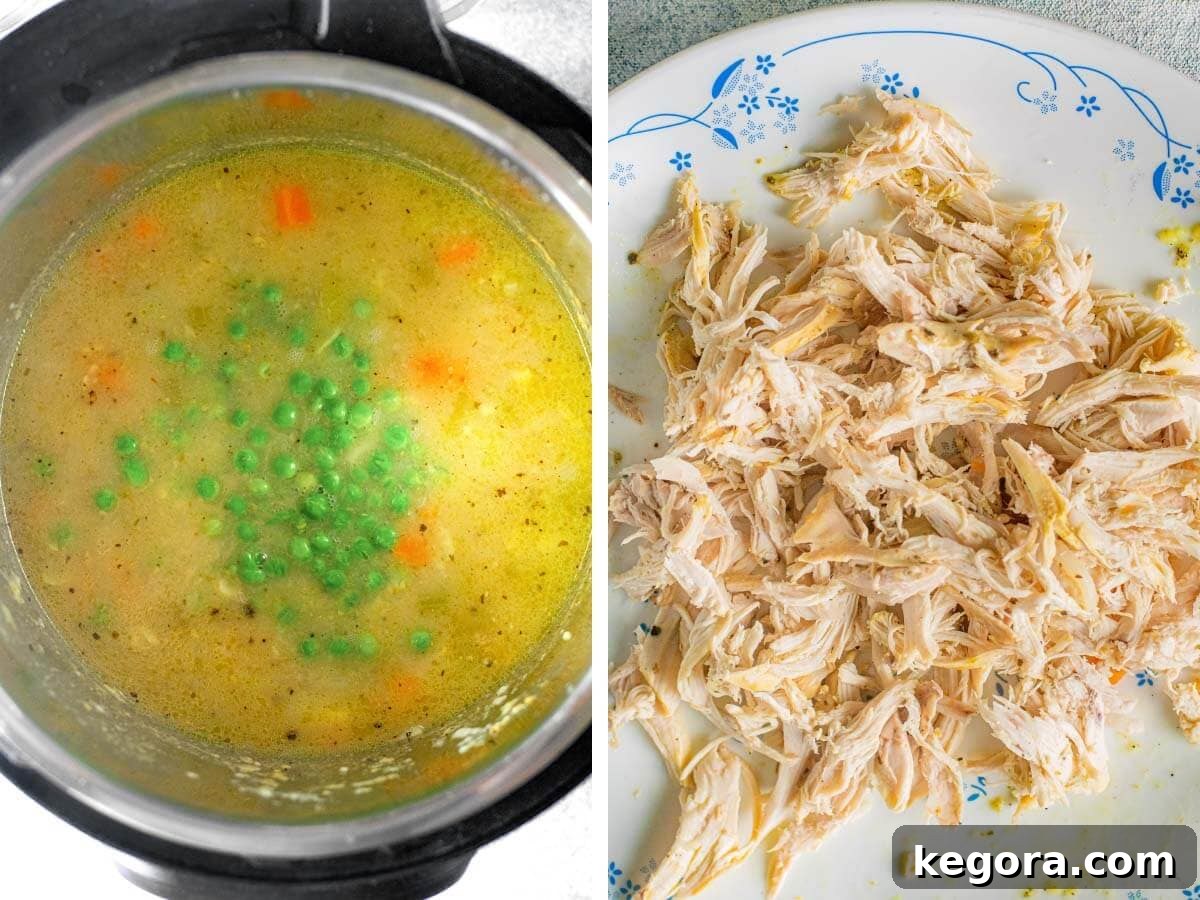 Frozen peas added to the soup in the Instant Pot, with shredded chicken on a plate next to it, after pressure cooking.