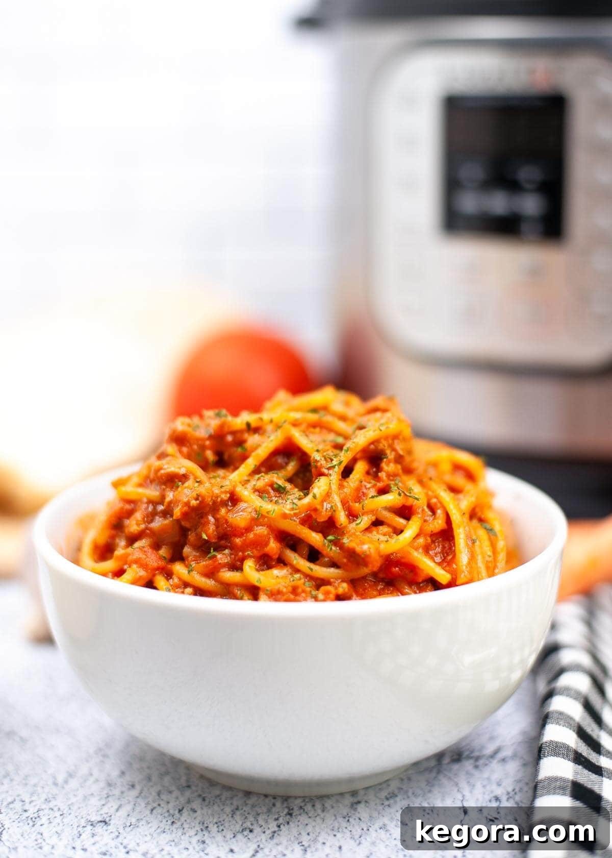 bowl of Spaghetti Bolognese in front of an IP.