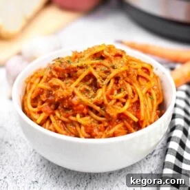 Instant Pot Spaghetti Bolognese in a white bowl.
