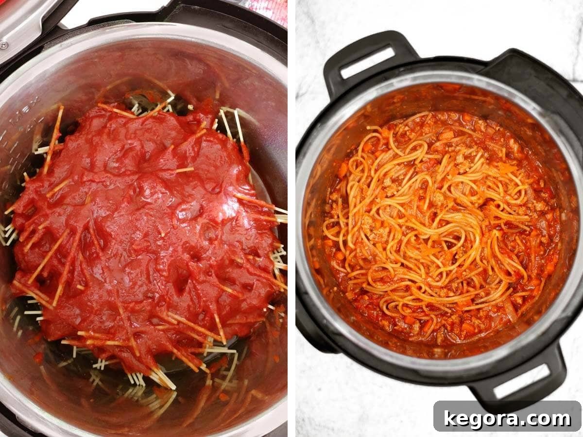 tomatoes over pasta in pot, cooked spaghetti in pot.