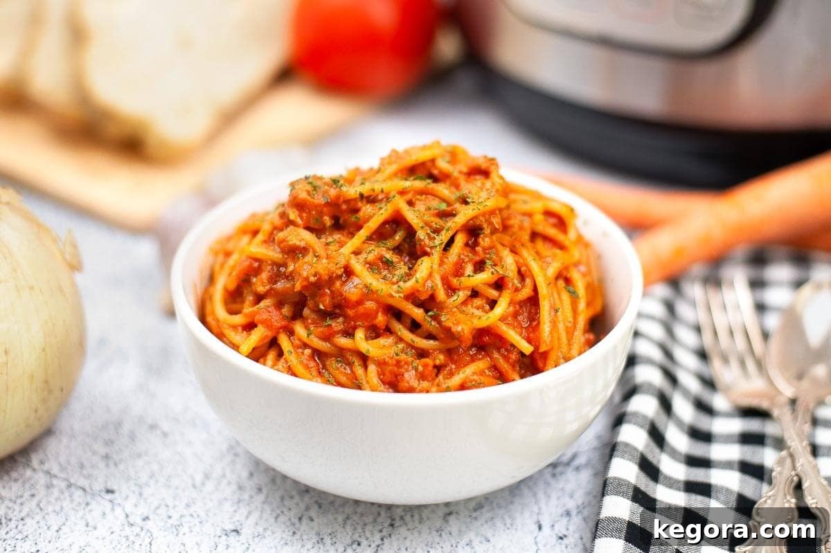 Spaghetti Bolognese in a white bowl.
