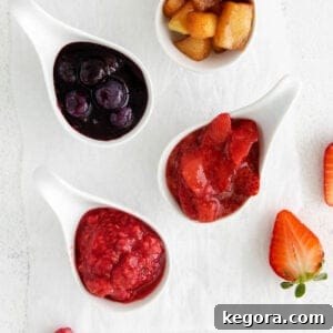 Four types of fruit compote arranged in ladles on a countertop