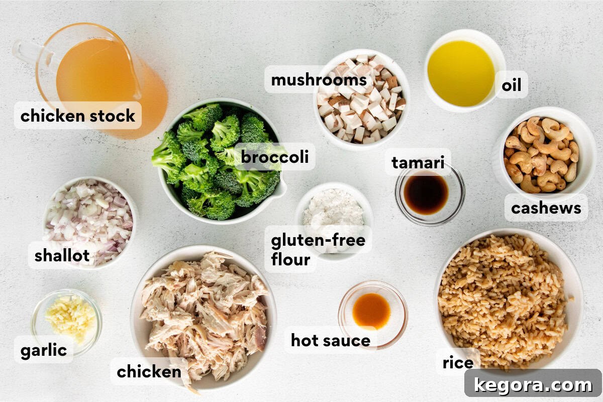 Wholesome Dairy-Free Gluten-Free Chicken Rice Bake 4 A selection of fresh ingredients for a dairy-free chicken and rice casserole laid out on a clean kitchen countertop.