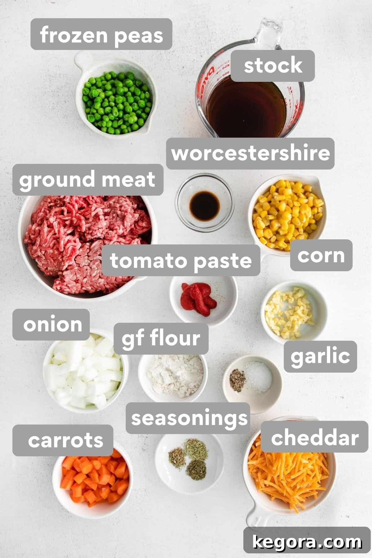 Wholesome Gluten-Free Shepherd's Pie 4 Ingredients set on the counter for the meat and vegetable layer of shepherd's pie, including ground meat, onions, carrots, and spices.