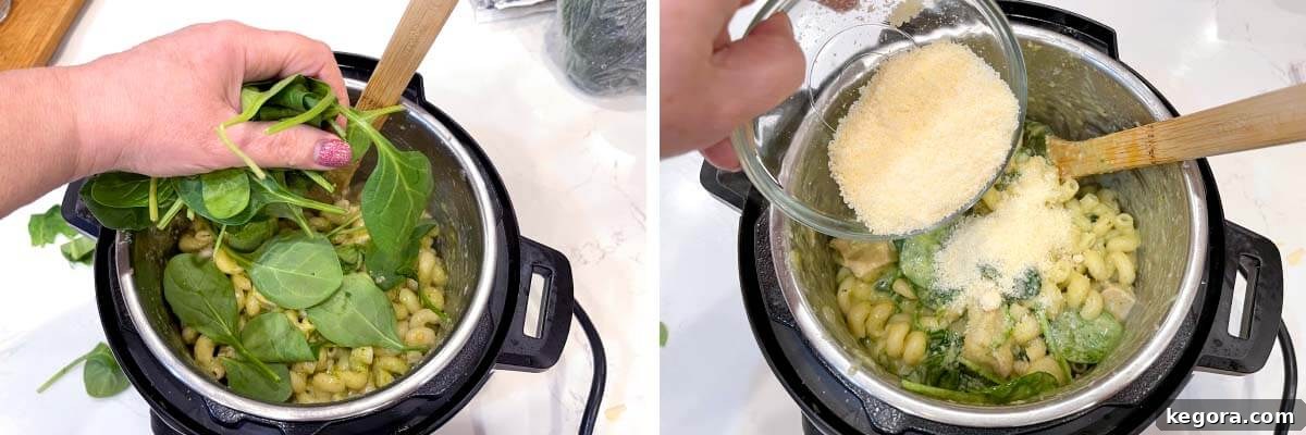 Fresh baby spinach being added to the cooked chicken pesto pasta, followed by grated Parmesan cheese.