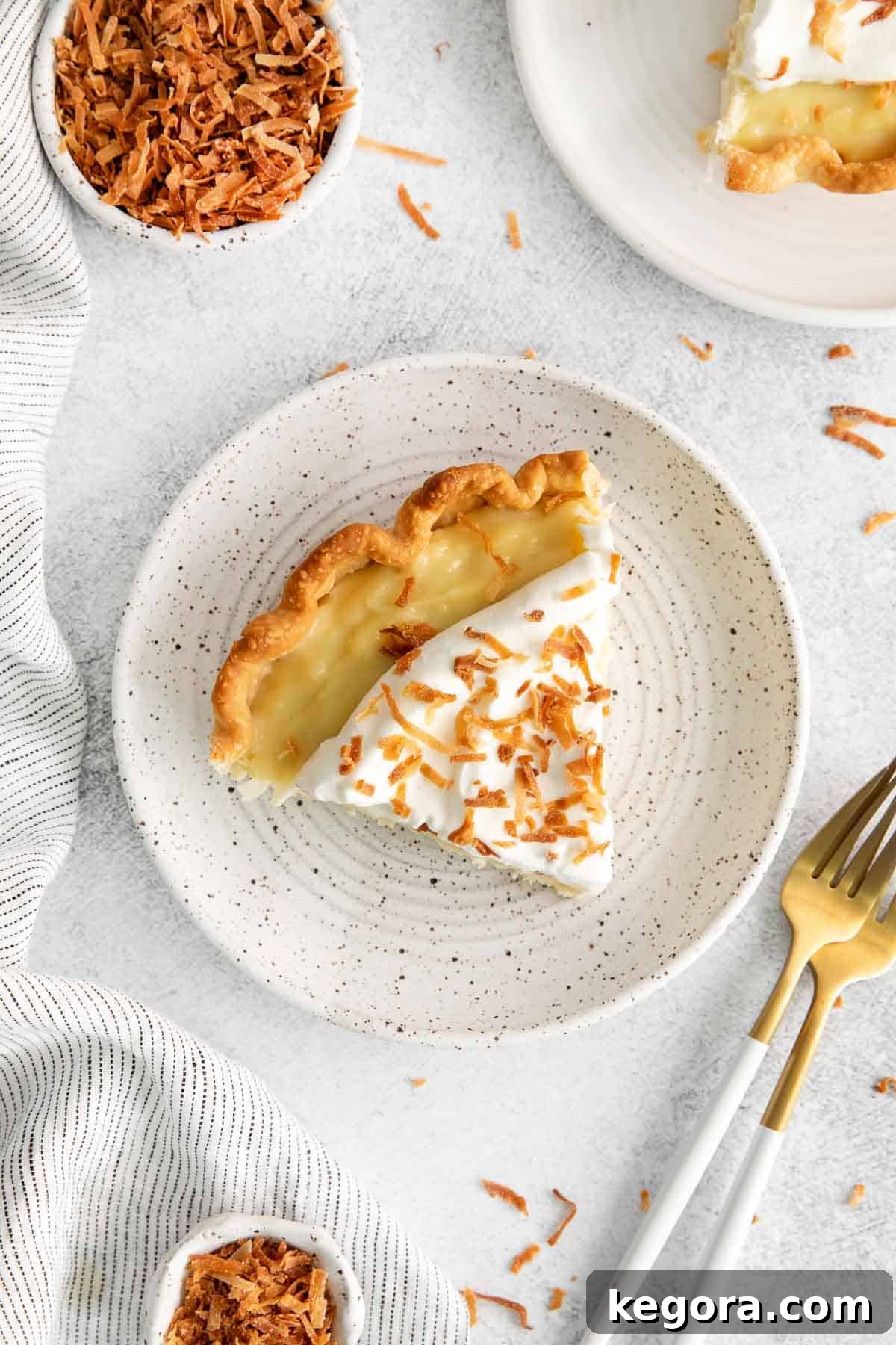 Vegan Coconut Cloud Pie 7 An overhead look at a slice of coconut cream pie on a plate