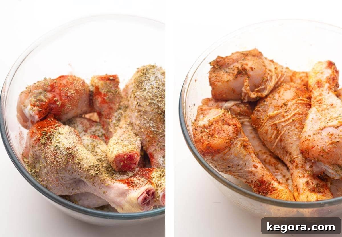 raw chicken in bowl with spices, chicken coated with spices.