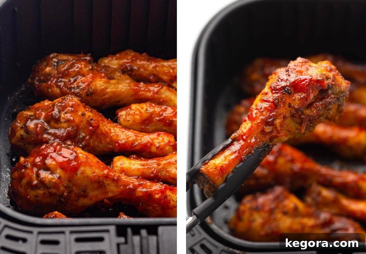 bbq sauce added to cooked chicken in AF pan, piece held with tongs.