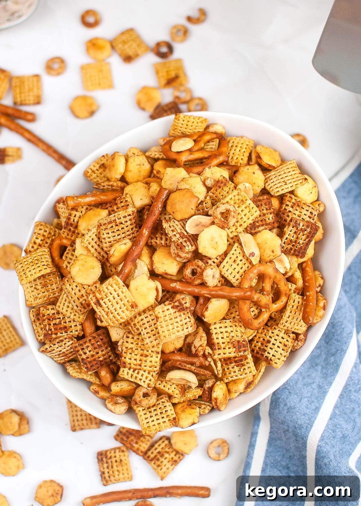 Quick and Crispy Air Fryer Chex Mix 2 Air Fryer Chex Mix in a white bowl.