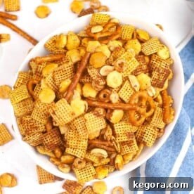 Quick and Crispy Air Fryer Chex Mix 9 Chex Mix in a white bowl