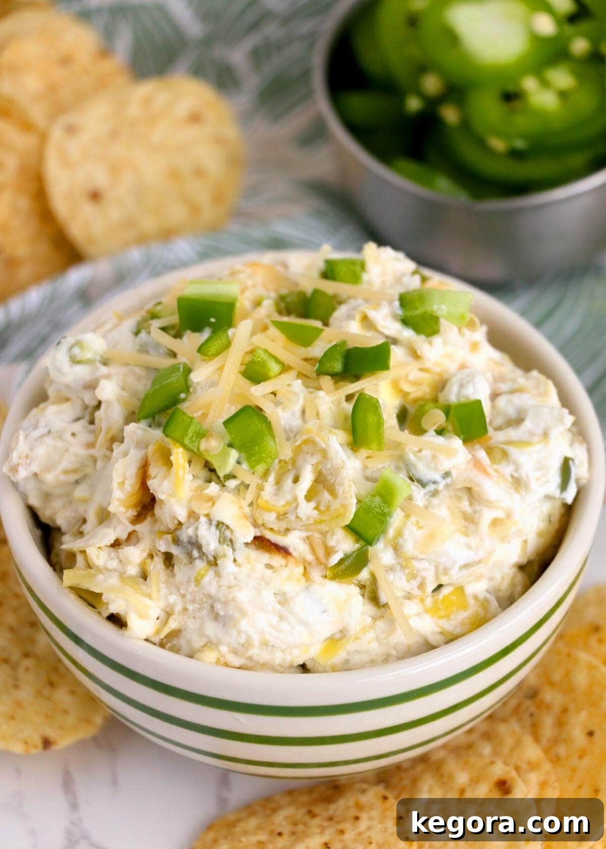Baked Artichoke Jalapeño Dip in a beautifully styled bowl, ready to be served as a party appetizer.