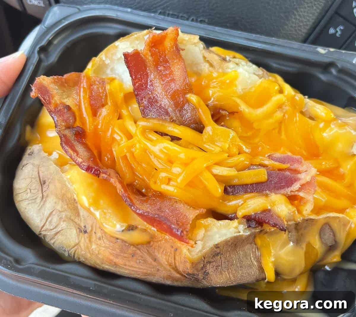 Wendy's gluten-free baked potato in a plastic container