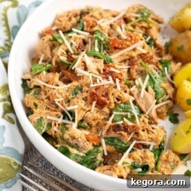 Slow Cooker Marry Me Chicken in a white bowl.