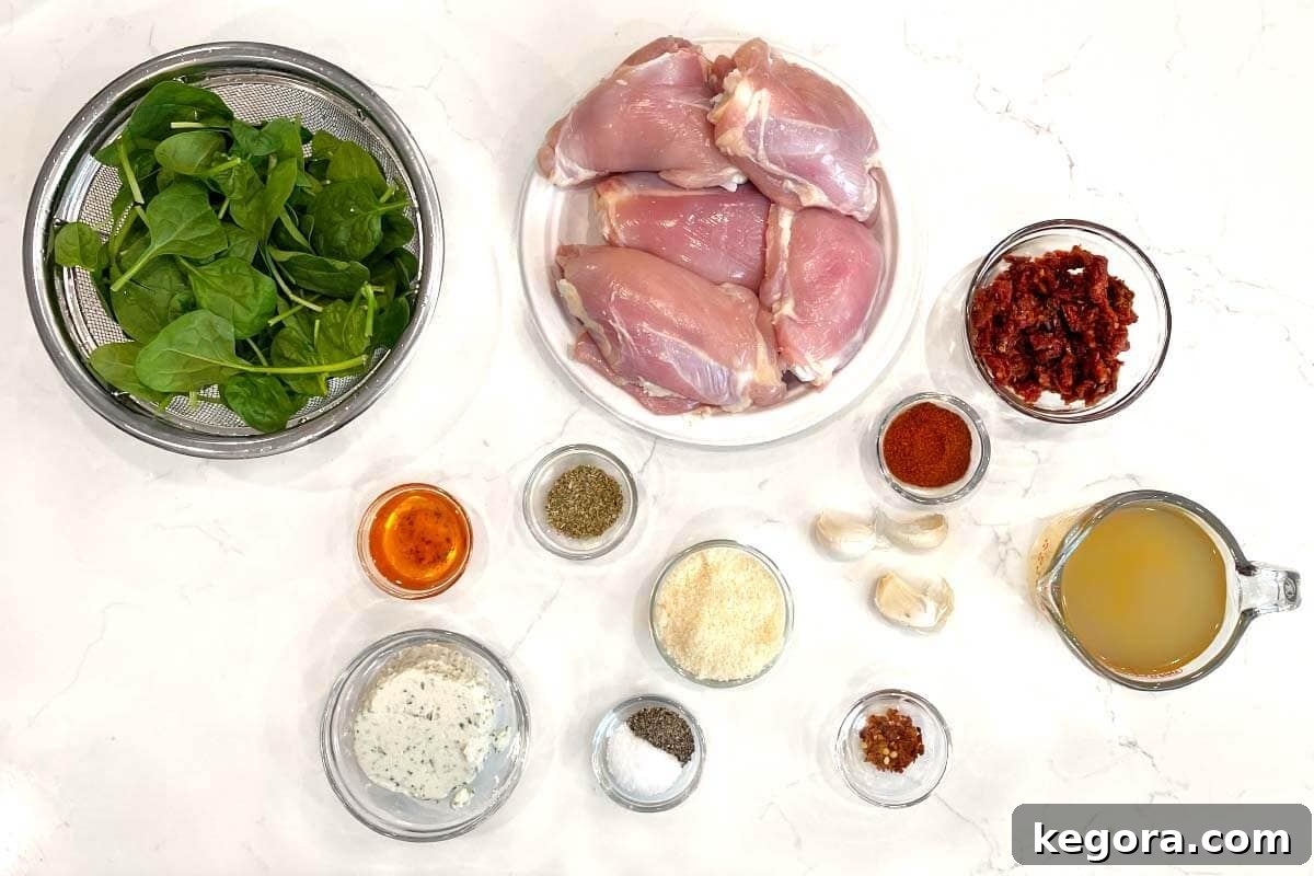 Effortless Slow Cooker Marry Me Chicken 4 Various ingredients for Slow Cooker Marry Me Chicken laid out for preparation.