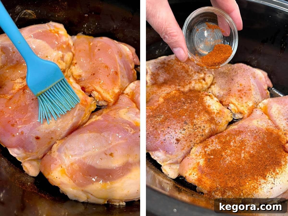 Effortless Slow Cooker Marry Me Chicken 5 Blue brush oiling boneless chicken thighs, followed by seasoning with paprika.