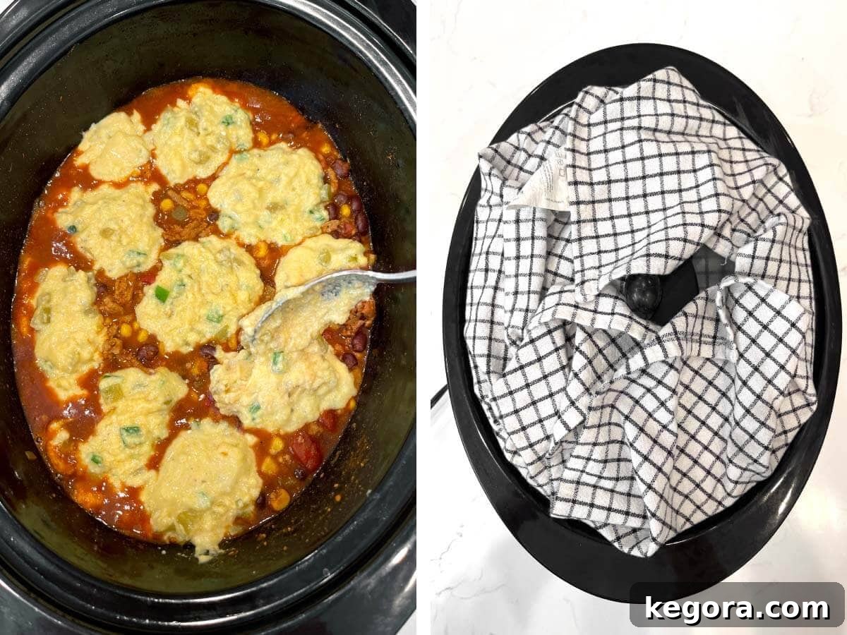 spooning cornbread batter on meat mixture, tea towel wrapped around lid on slow cooker.