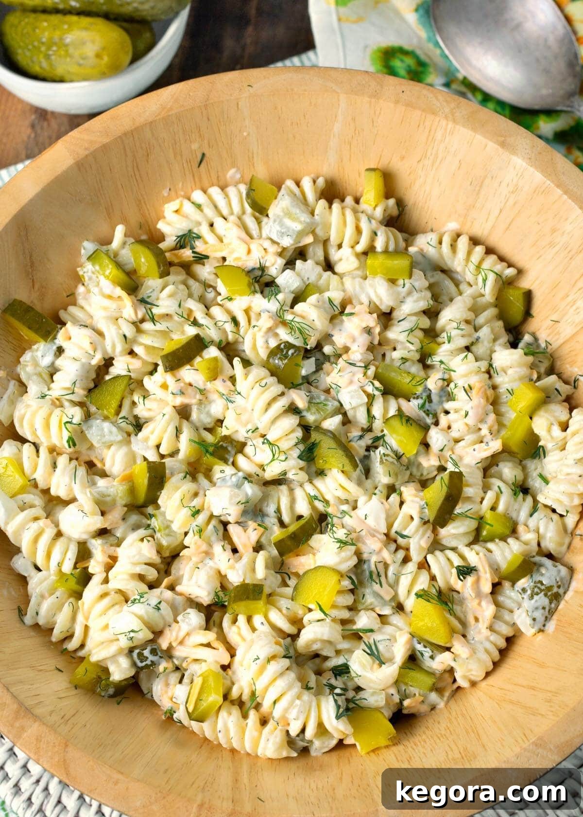 Zesty Dill Pickle Pasta Delight 2 Dill Pickle Pasta Salad in wood bowl.