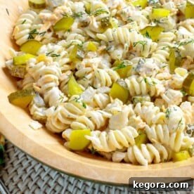 Zesty Dill Pickle Pasta Delight 11 Dill Pickle Pasta Salad in wood bowl.