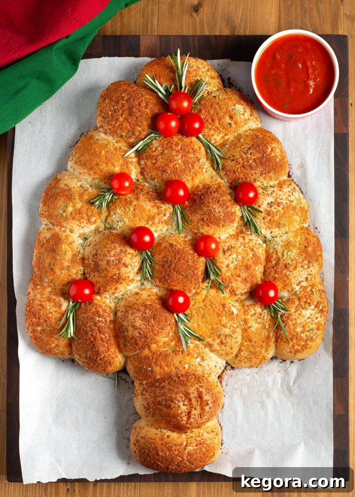 Dinner Roll Christmas Tree Appetizer with tomatoes and rosemary.
