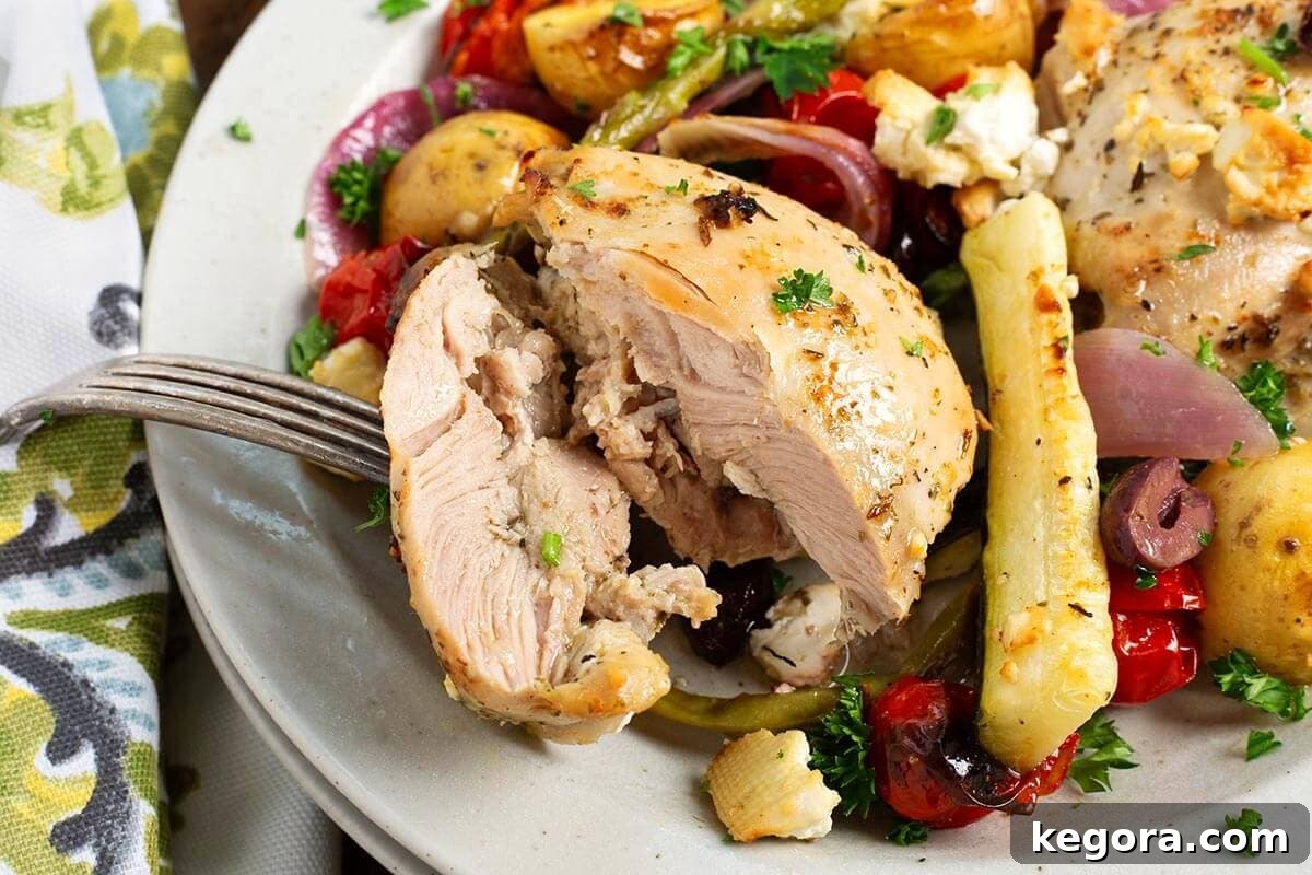 One-Pan Greek Lemon Herb Chicken 3 Greek Sheet Pan Chicken Dinner closeup of chicken thigh