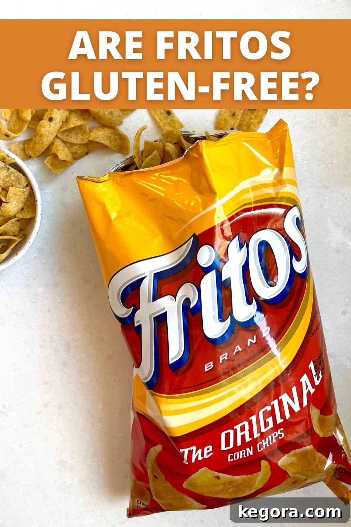 An open bag of Original Fritos corn chips placed on a clean white kitchen counter, ready for snacking.