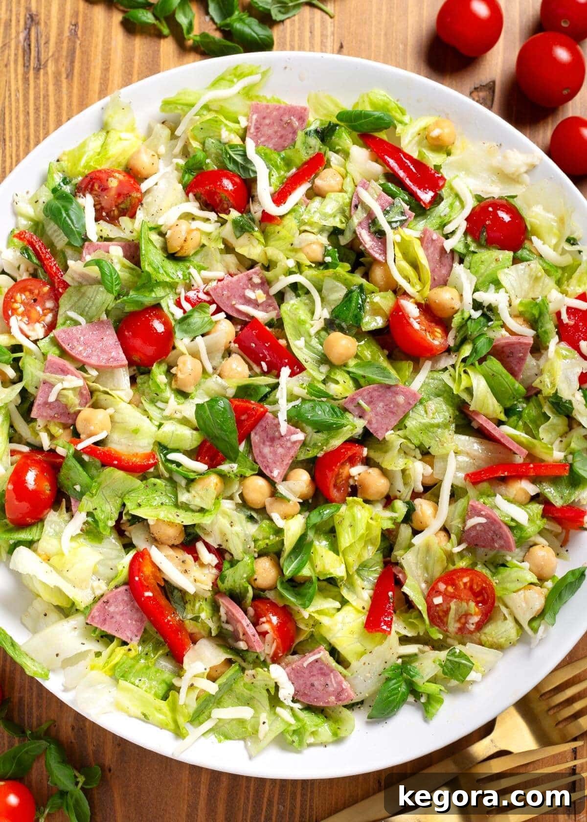 Zesty Italian Chopped Salad 2 Vibrant Italian Chopped Salad served in a pristine white bowl, showcasing its colorful ingredients and appealing texture.