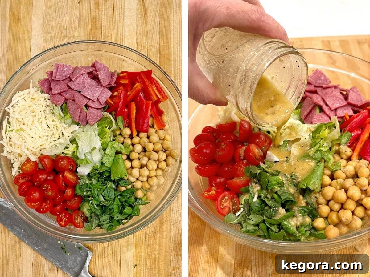 Zesty Italian Chopped Salad 6 A large glass bowl filled with freshly chopped iceberg lettuce, halved cherry tomatoes, and garbanzo beans, with Italian dressing being drizzled over the top.