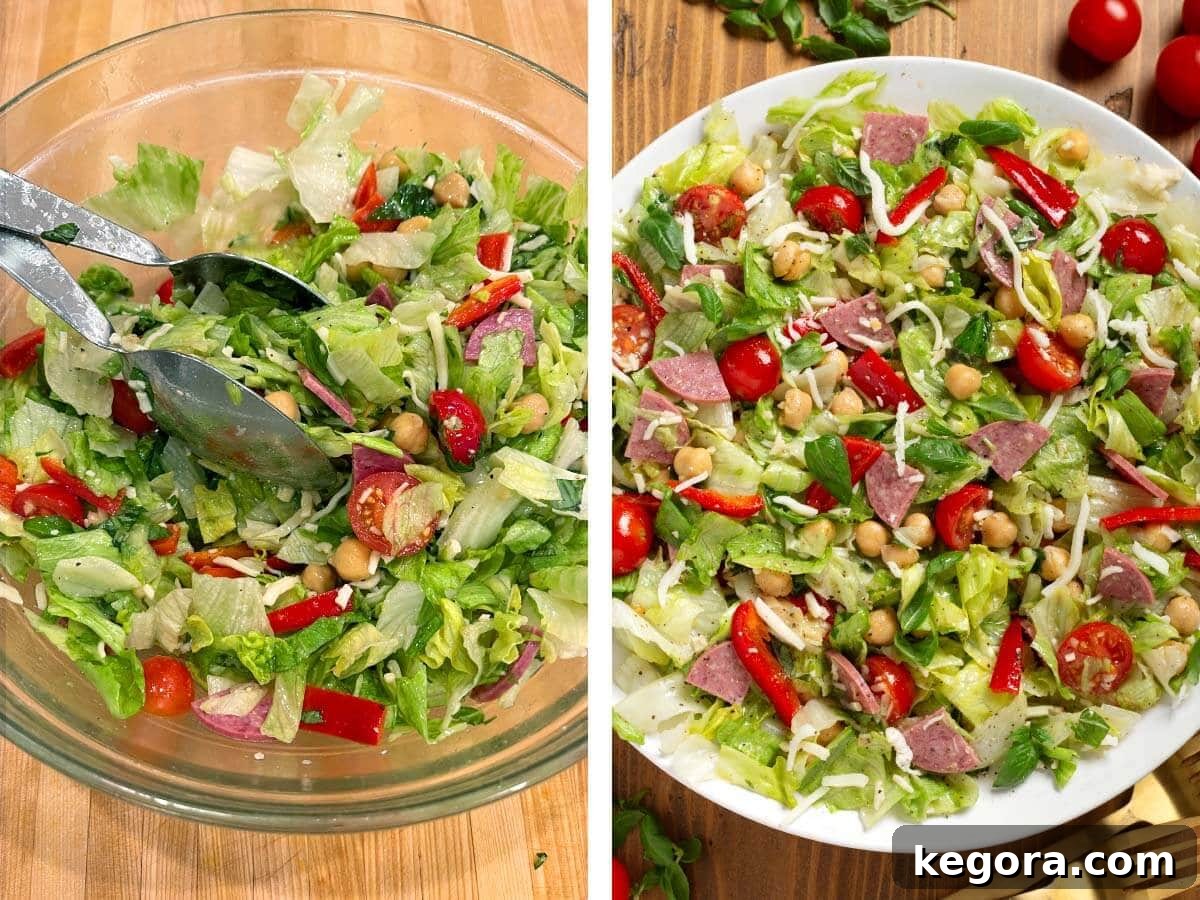 Zesty Italian Chopped Salad 7 Hands gently tossing a colorful Italian Chopped Salad in a large glass bowl, ensuring the dressing coats every ingredient evenly.