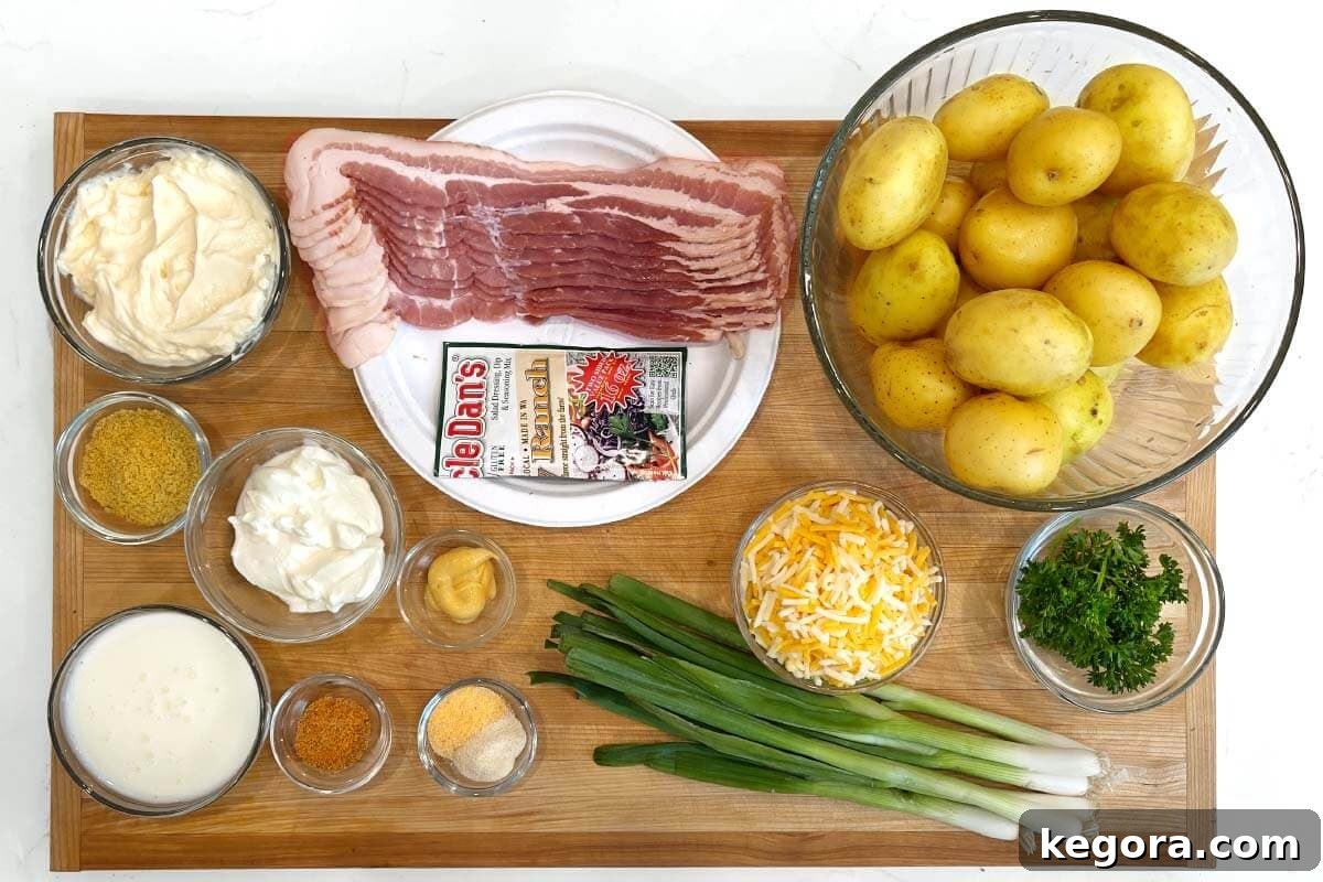 Creamy Bacon Cheddar Potato Salad 5 Loaded Potato Salad ingredients on a board