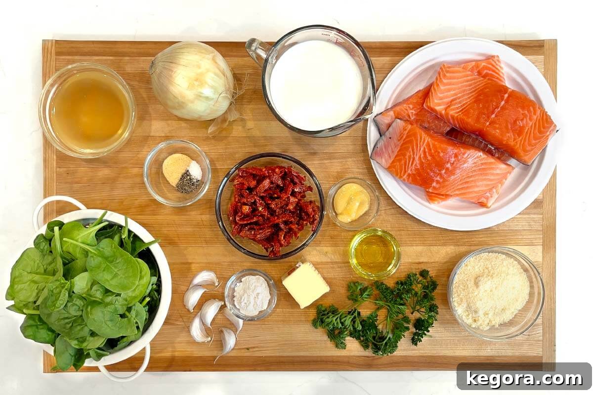 Decadent Creamy Garlic Tuscan Salmon 4 A beautiful flat lay of fresh ingredients for Creamy Garlic Tuscan Salmon, including salmon fillets, spinach, sun-dried tomatoes, garlic, and herbs, arranged on a rustic wooden board.