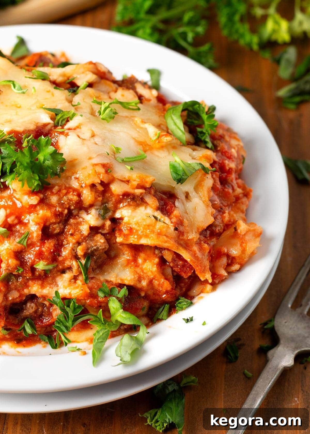 Slow Cooker Lasagna serving on a white plate