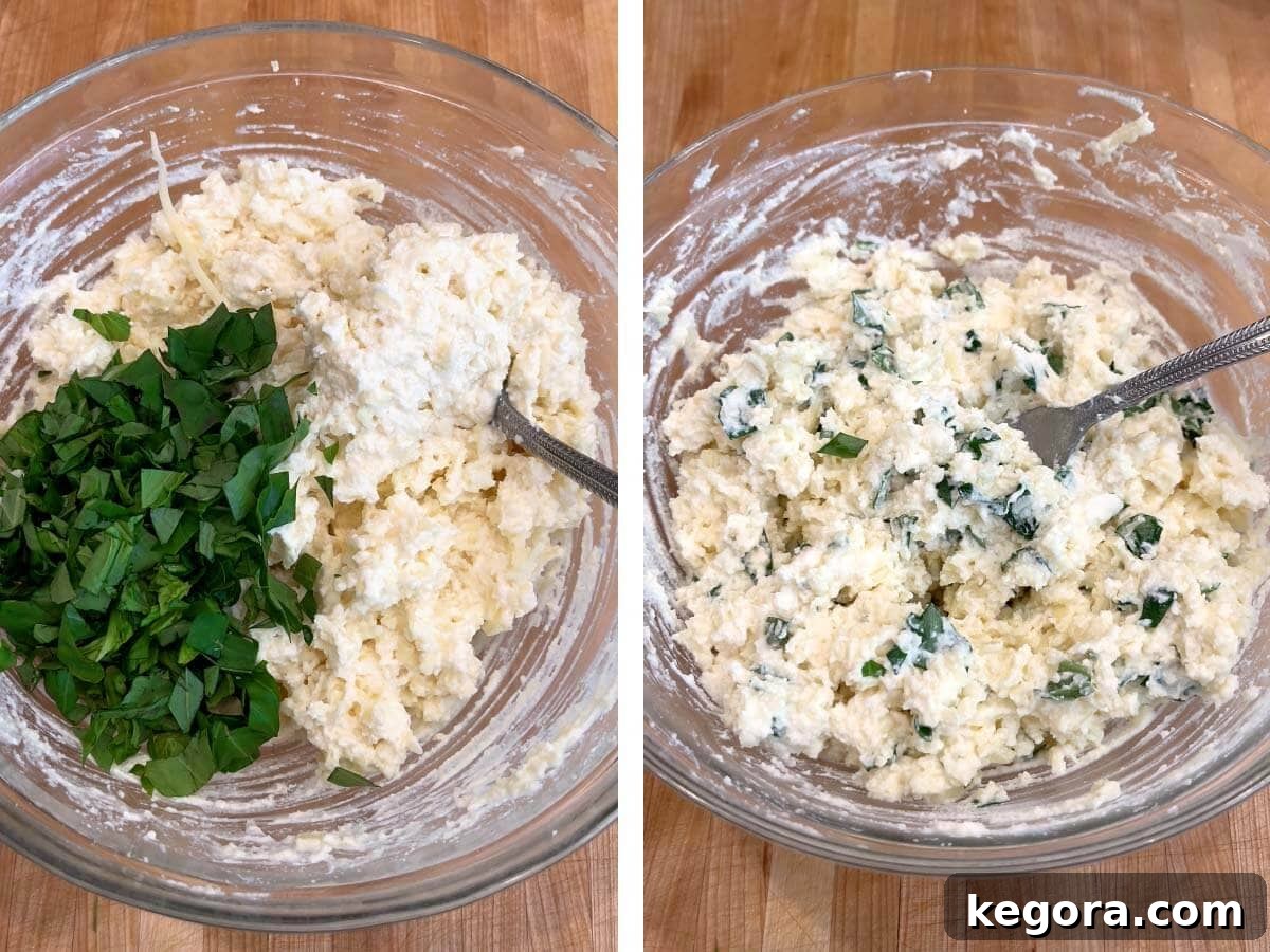 basil added to cheeses in bowl, cheeses mixed with basil.