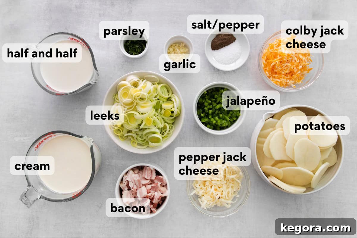 A selection of gluten-free scalloped potato ingredients laid out on a kitchen countertop, including potatoes, bacon, leeks, cheeses, and herbs.